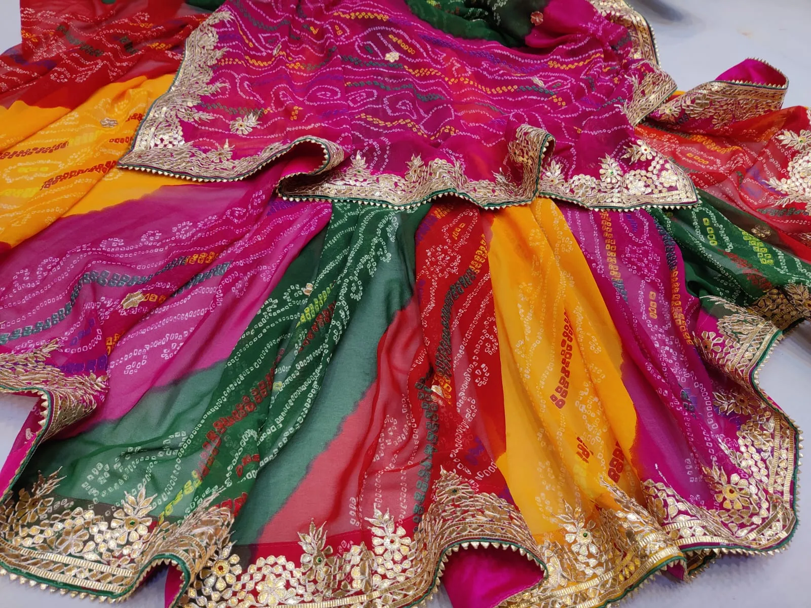 Traditional multicolor Bandhej Sarees In Gota Work